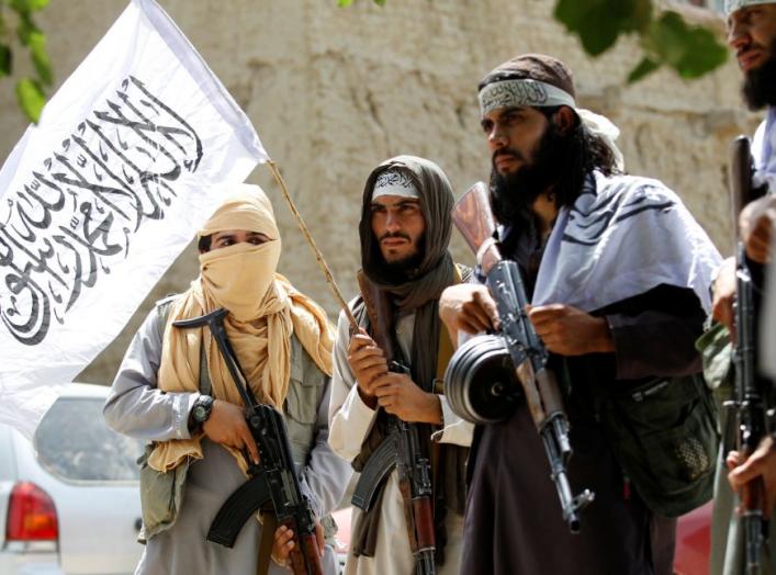 Taliban walk as they celebrate ceasefire in Ghanikhel district of Nangarhar province, Afghanistan June 16, 2018.REUTERS/Parwiz